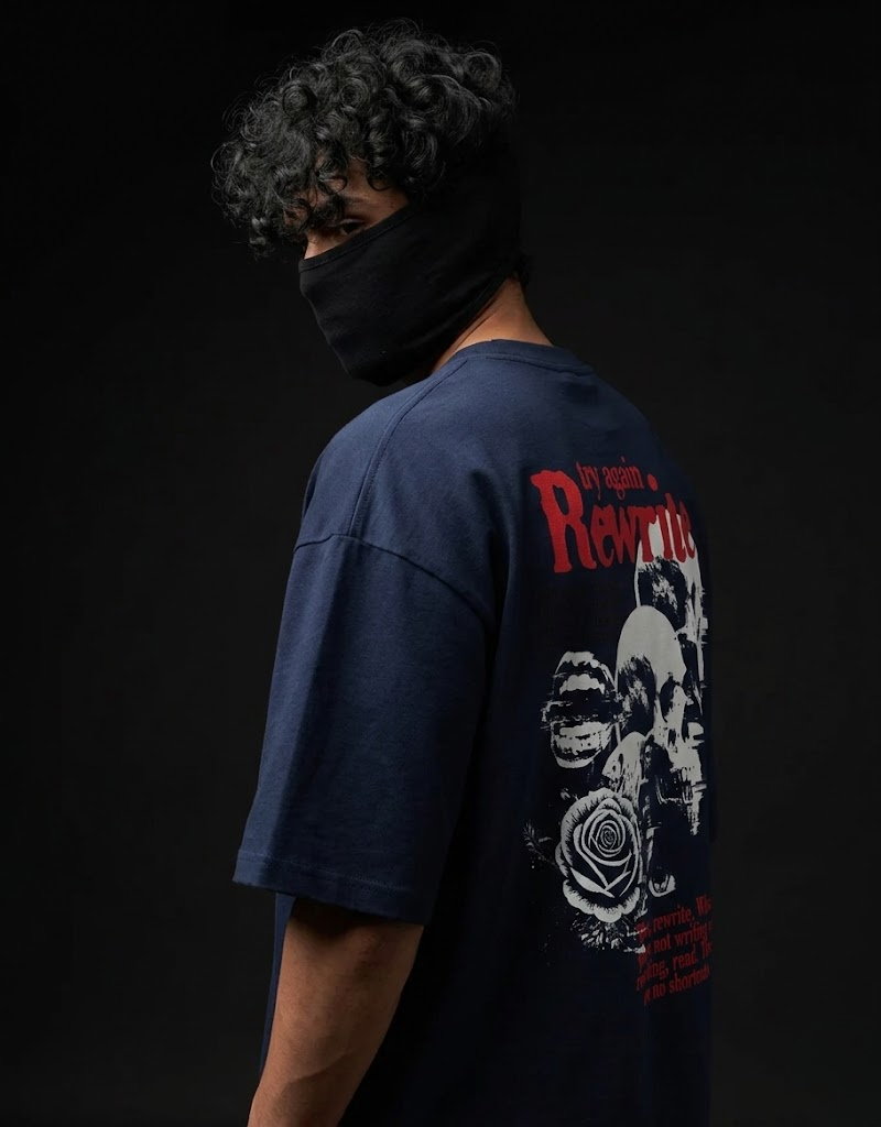 Goatkapda Rewrite product in white fabric with red and black embroidery, featuring intricate design details.