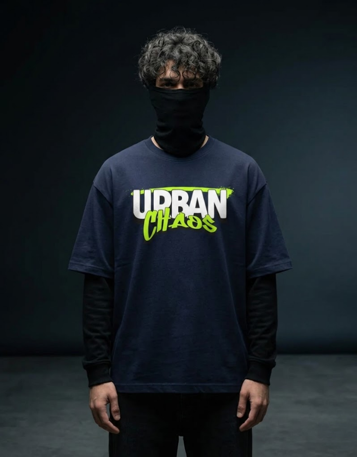 Urban Chaos t-shirt by Goatkapda featuring bold graphic print on black fabric, casual streetwear style.