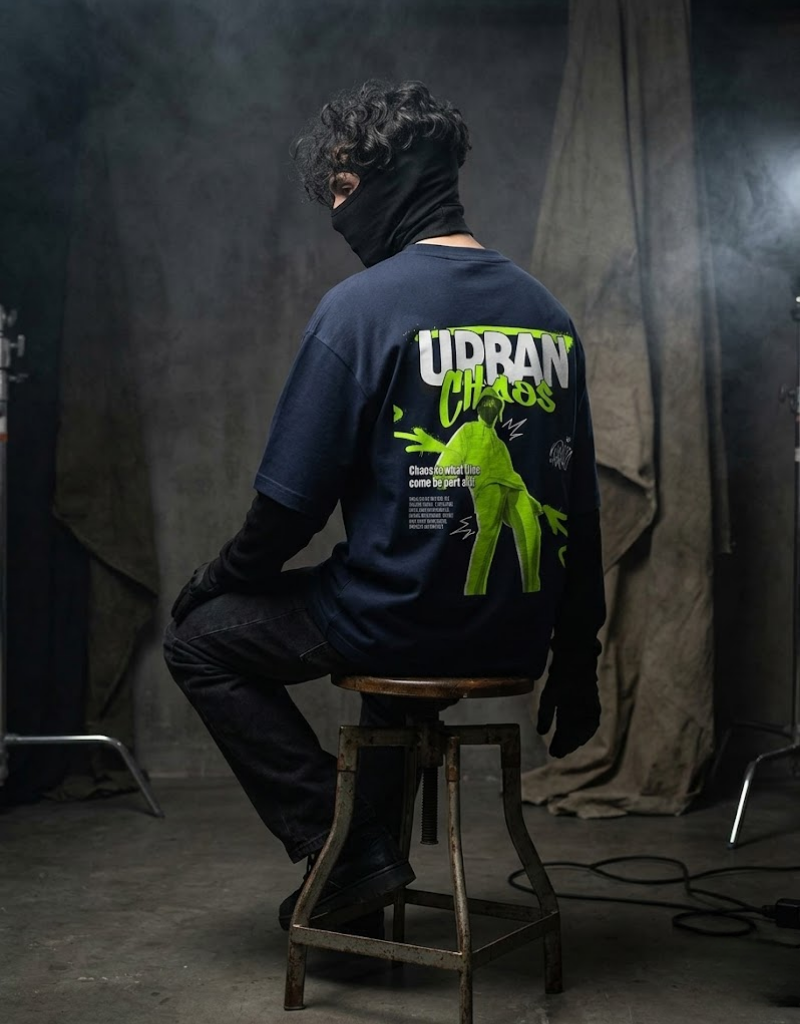 Urban Chaos t-shirt by Goatkapda featuring bold graphic design and urban style, with black fabric and striking print.