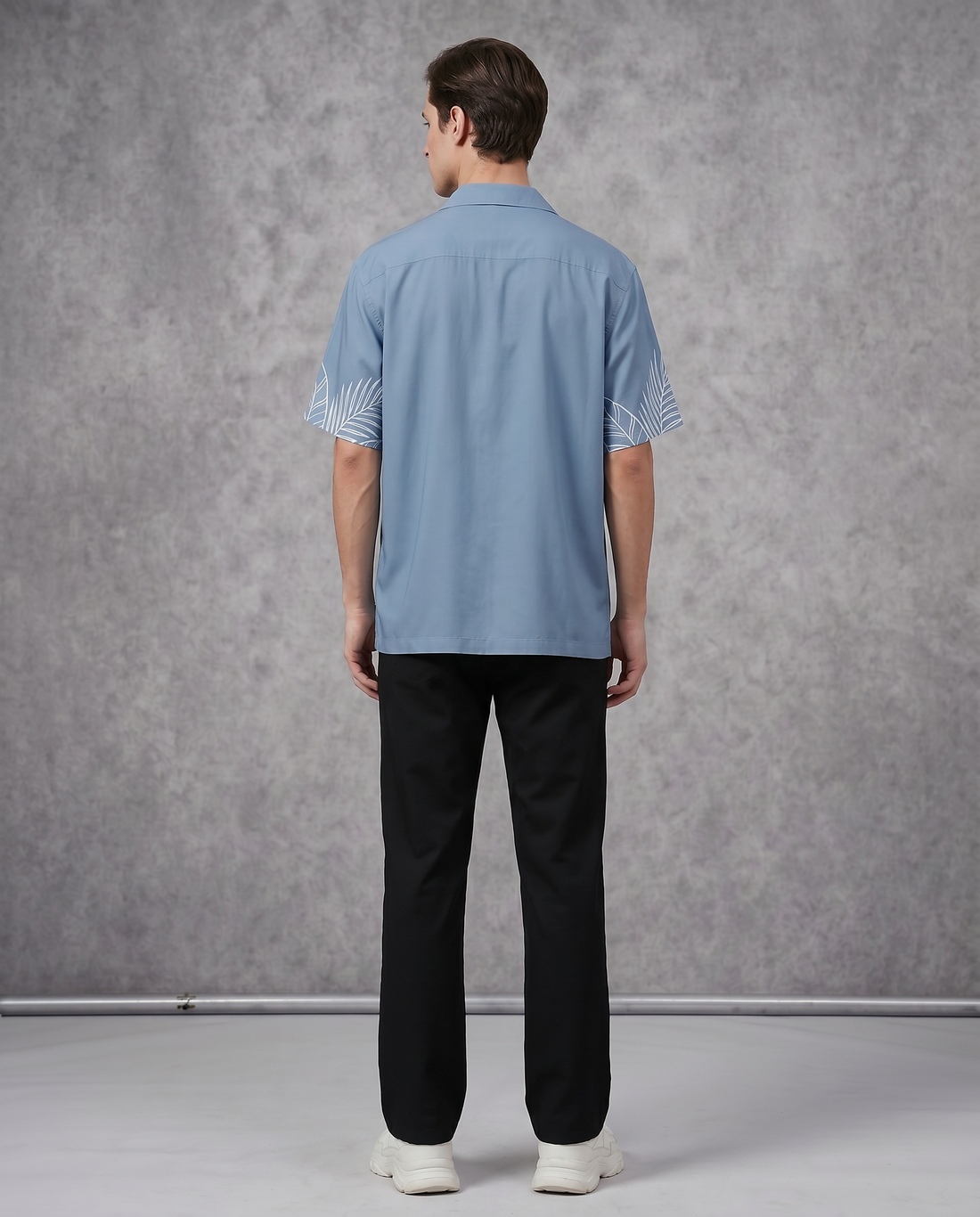 Sky blue tropical flamingo shirt by Goatkapda, featuring a vibrant flamingo print on lightweight fabric.