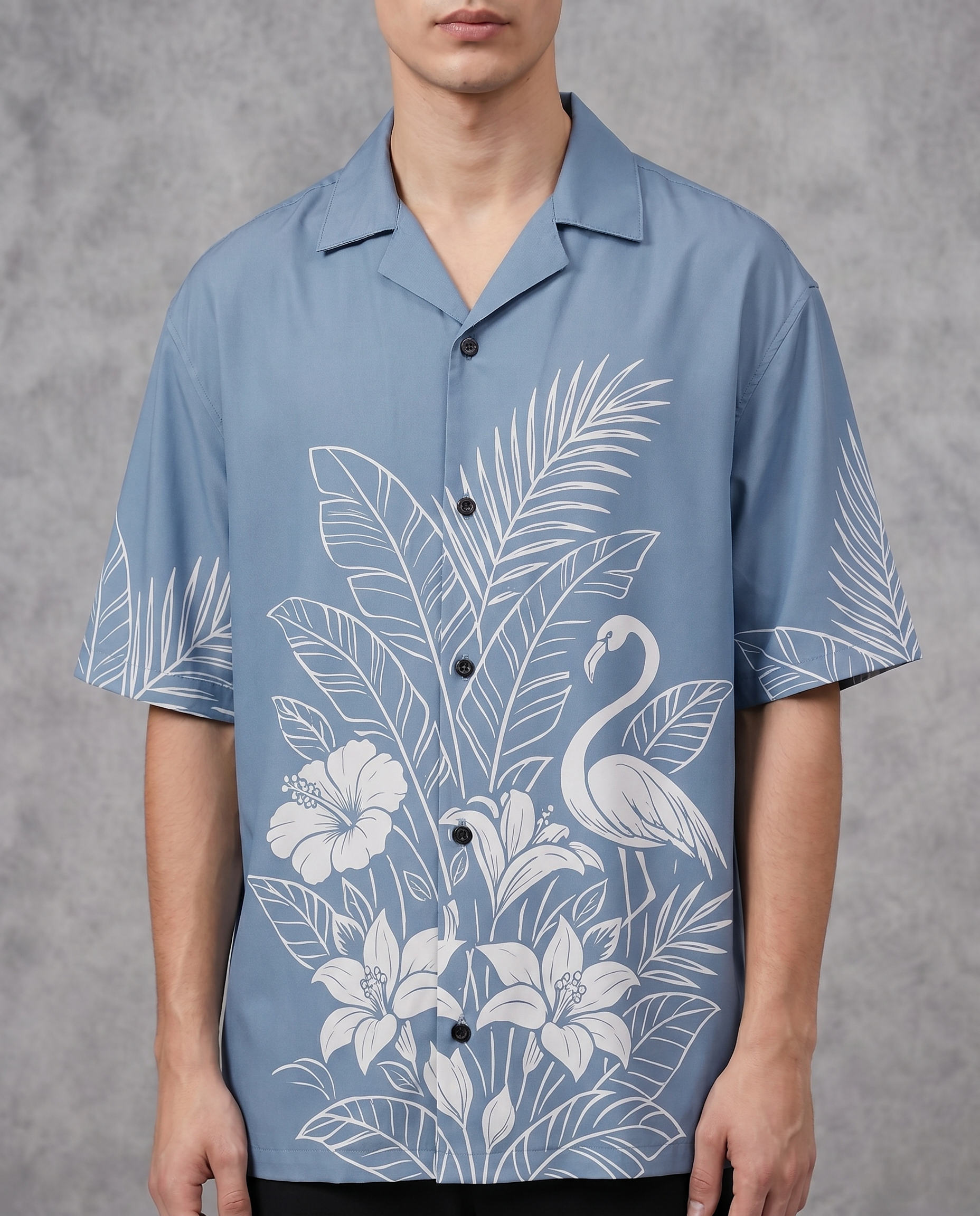 Sky blue tropical flamingo shirt by Goatkapda featuring a vibrant flamingo and tropical leaf pattern on lightweight fabric.